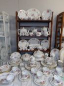 In excess of 120 pieces of Royal Crown Derby 'Posies' table ware with red and green back stamps.