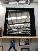 A square bevel-edged mirror with bevelled,