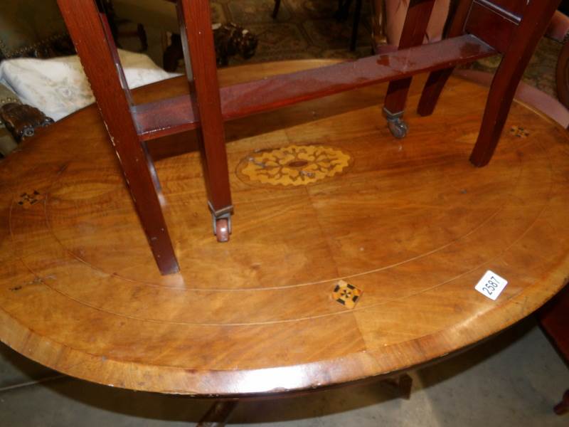 A oval Victorian mahogany inlaid loo table on 'birdcage' base. - Image 2 of 2