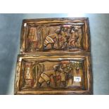 2 carved wooden plaques featuring Caribbean scenes