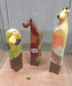 3 contemporary cow figures.