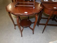 An Edwardian mahogany occasional table.