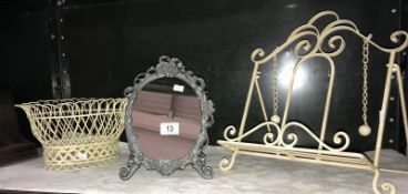 A wrought iron book stand basket and mirror