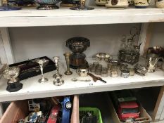 A quantity of silver plate including napkin rings, cruet set, candlesticks etc.