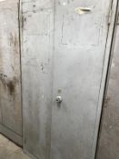 An industrial 2 door metal cabinet