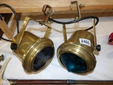 A pair of vintage style stage spot lights.