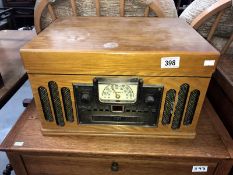 A vintage style radiogram with record player and compact disc