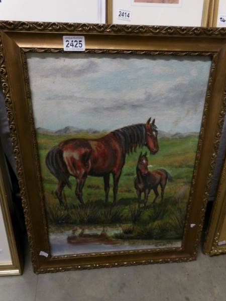 An oil on board painting of 2 horses (mare and foal) in a field, signed and dated Tony Bundell,