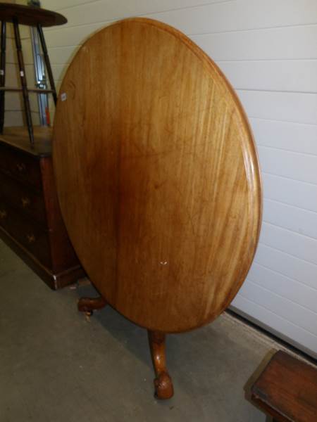 A Victorian mahogany circular tip top table.