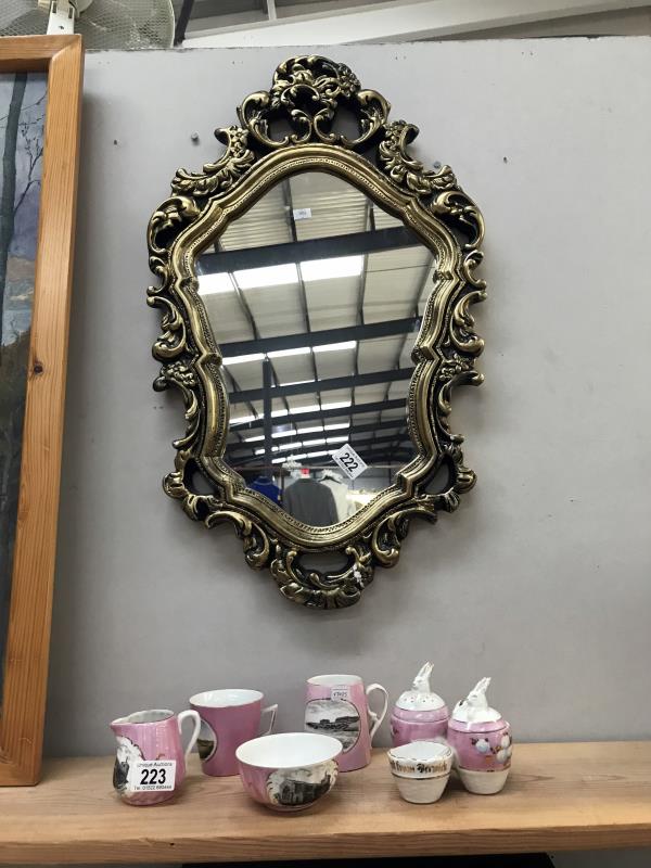 An ormolu style gilt framed mirror