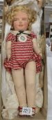 An original 1930's Shirley Temple Allwin cloth doll with original badge, label and in original box.