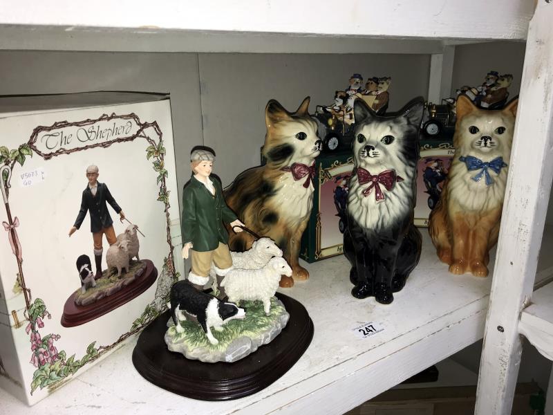 3 ceramic cats,