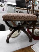 A Georgian mahogany stool with re-upholstered seat.