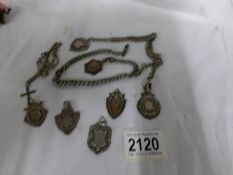 A silver double Albert watch chain with silver fob, a silver fob on white metal chain,