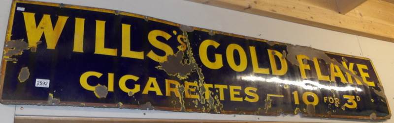 An enamel sign for Will's Golden Flake (approximately 72.5" x 15").
