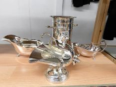 A silver plate wine bottle holder, sugar scuttle, sauce boat and gravy boat.