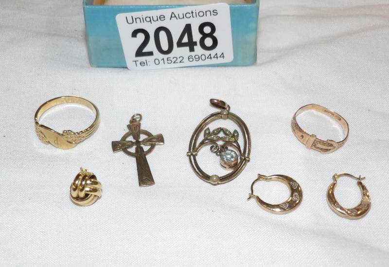 A mixed lot of gold items including pair of earrings, 9ct gold cross, gold ring etc.