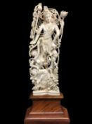 An ivory figure of Durga on a teak base with radiocarbon dating measurement report dated February