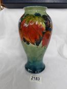 A mid 20th century Moorcroft leaf and blackberry vase with box.