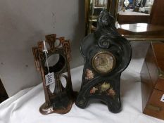 An art nouveau metal clock case and a Bretby mantel clock.