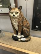A cast iron cat doorstop
