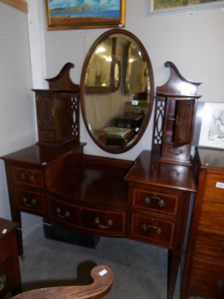 An Edwardian mahogany inlaid dressing table.