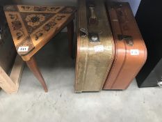 2 vintage suitcases and a musical side table