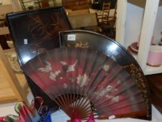 2 oriental lacquered trays and a fan.