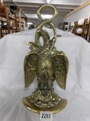 A Victorian cast brass eagle door stop.