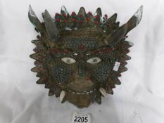 An old metal tribal wall mask.