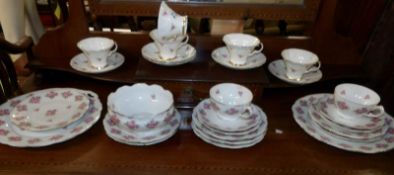 A quantity of rose decorated tea ware.