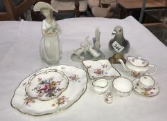 A Beswick pigeon, Nao lady with basket of flowers, a geese group figurine,