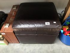 A square leather foot stool/pouffe