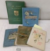 A Longfellow 1913 calendar, A book entitled 'The Story of Lincoln' and other books.