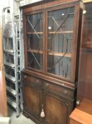 A mahogany astragal glazed bookcase with dental cornice