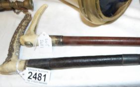 A Wilkinson Saddlery, Grantham riding crop and a silver banded riding crop.