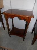 An Edwardian oak side table.