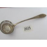 A Georgian silver sifter spoon (approximately 50 grams).