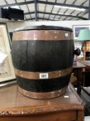 A wooden lidded barrel.