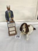 A Coalport figure 'The Pie Maker' and a Sylvac dog.