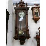 A Victorian double weight mahogany Vienna wall clock.