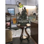 A Tiffany style figure group lamp on side table