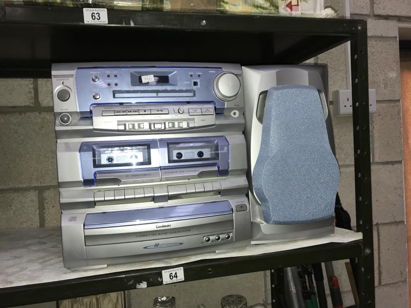 A Goodman's 3 disk twin cassette music system with 1 speaker.