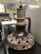 A pottery lamp base.
