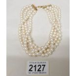 A pearl choker.