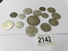A quantity of pre 1920 silver coins from the reigns of Queen Victoria,
