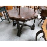 An oak coffee table on carved legs.