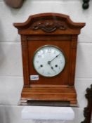 An oak bracket clock.