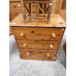 A pine 3 drawer chest.
