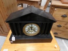 A slate Palladian style mantel clock.